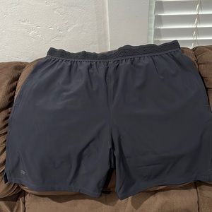 Fabletics 7” fundamental Mens shorts size large